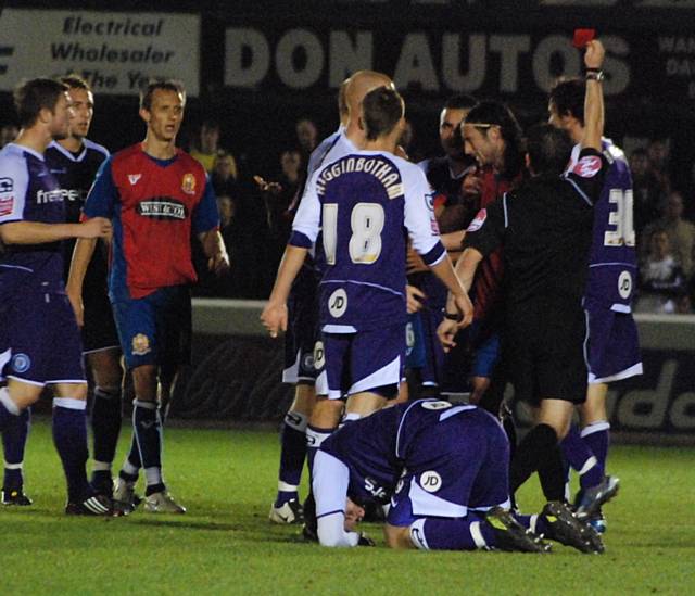 Wesley Thomas sees red for his over the top tackle on Dagnall.