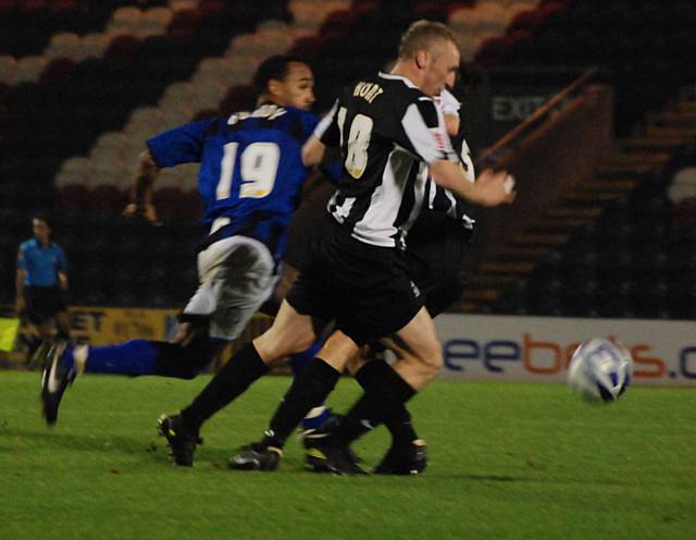 Notts County defenders collide to put Chris O'Grady in the clear to give Dale the lead.