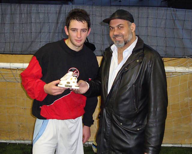 Tahir Mahmood presenting the player of tournament award to Jon Sebbar of Bradford Allstars