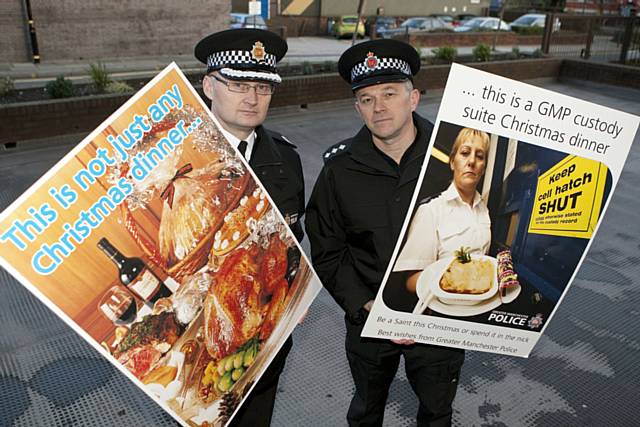 Assistant Chief Constable Terry Sweeney and Chief Inspector of Volume Crime, Mark Gibby from the South Manchester Division with examples of the Christmas card which is being sent out to suspected offenders in Greater Manchester.