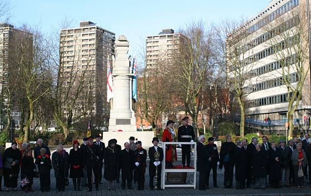 The Mayor, Councillor Keith Swift and The Lord Lieutenant and Col Brian Gorski prepare for the salute by the town hall alongside other local dignatories.