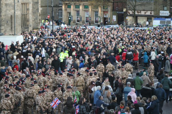 A huge crowd gathers with the fusiliers following the parade.