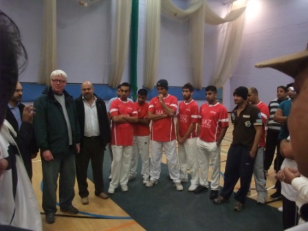 Paul Rowen speaks to the teams before the start of the Rochdale Sports and Cultural Links cricket league.