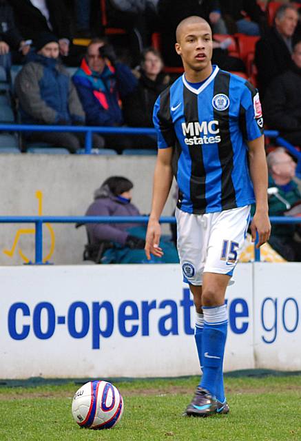 Joe Thompson stands over a Dale free kick.