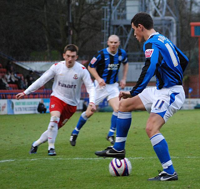 Adam Rundle holds possession in the Lincoln box.