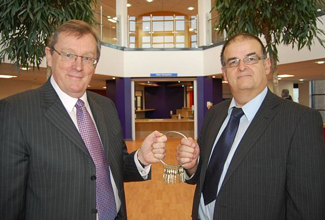 Chairman of NHS Heywood, Middleton and Rochdale, John Pierce (left) accepts the keys from Eric Wright Group's Project Co-ordinator, John Dean (right).