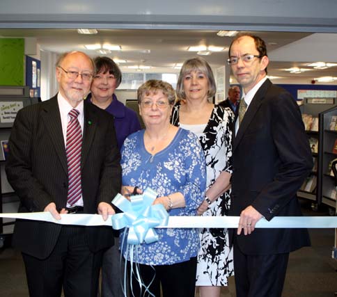 Jim Dobbin MP for Heywood and Middleton cuts the ribbon to Darnhill Library, with Kathleen Chorlton from Darnhill Residents group, Library staff Shelia Sfrijan and Ann Jones and Councillor Colin Lambert.