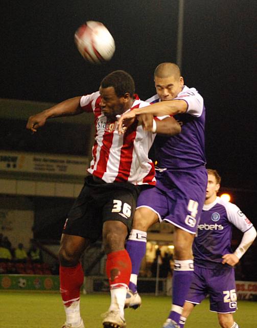 Stanton and Delroy Facey go up for a header.