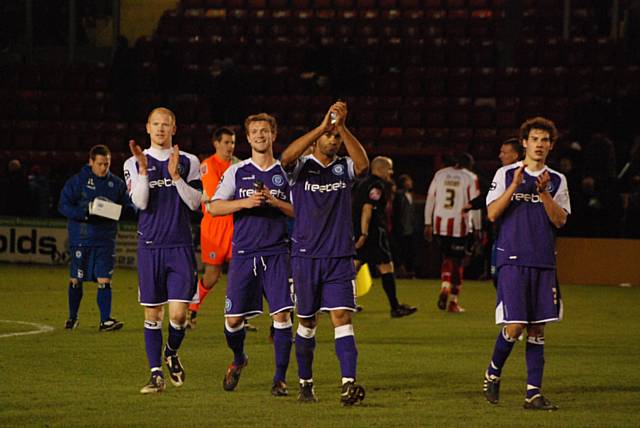 Players show their appreciation to the fans after picking up another win on the road.