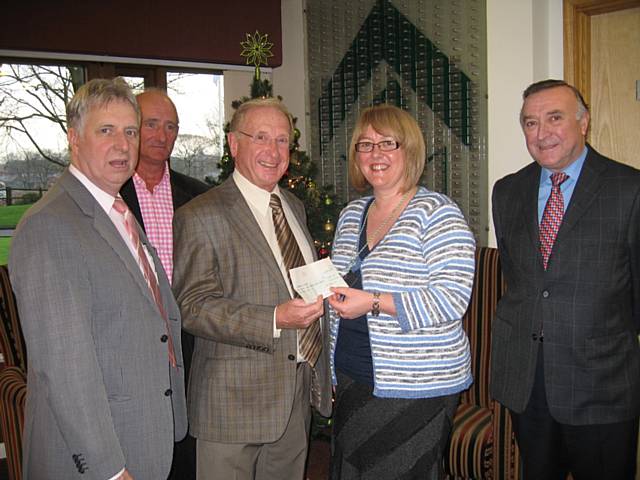 Freemasons present cheque to Springhill Hospice