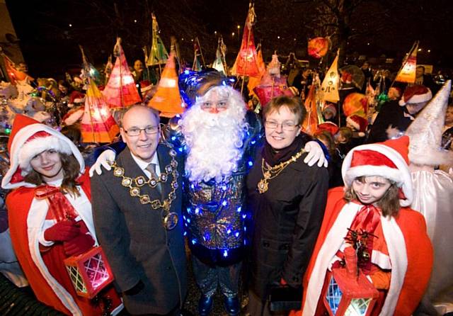 The Mayor and Mayoress of Rochdale with Father Christmas, local residents Pheobe Stagg and Chloe Webster and other young revellers at the Darnhill Christmas Festival.