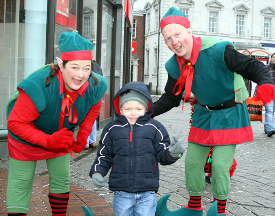 Dancing Elves with a young boy ready for Christmas