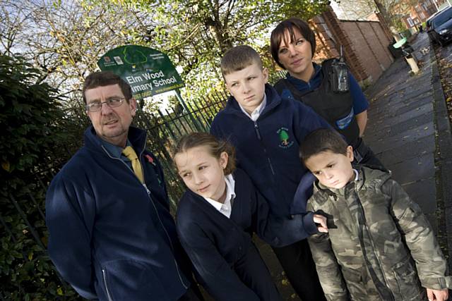 Pupils from Elmwood Primary School learn about the importance of crossing the road safely with PCSO Dominique Grimes.