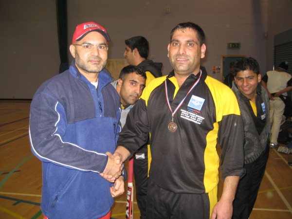 Rashid receives his man-of-the-match medal.