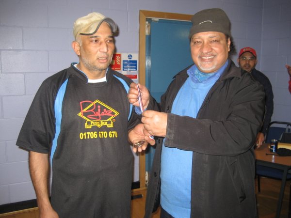 Shahid receives his man-of-the-match award.