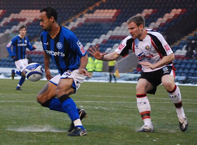 Chris O'Grady looks to turn part Terry Dunfield inside the Shrewsbury box.