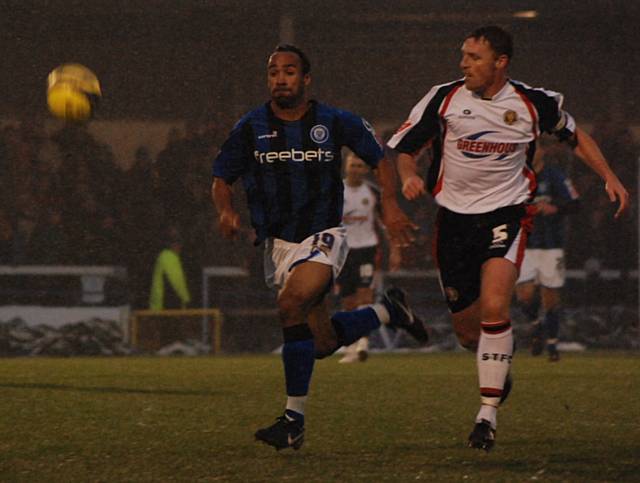 O'Grady and Graham Coughlan race for possession.