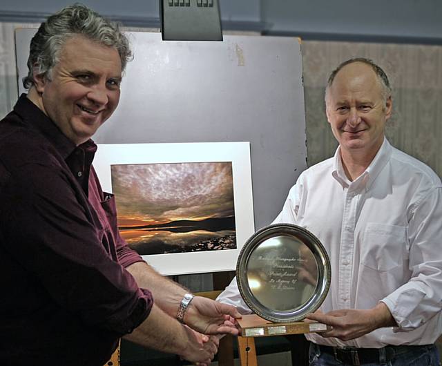 Rochdale Photographic Society's annual President's Print Competition was judged by the President, Andrew Hardwick (left), and awarded to Norman Holden for his print 'Sunset over Watergrove Reservoir'.