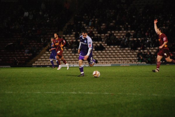 Dagnall beats the offside trap to race clear on goal.