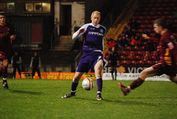 Jason Kennedy lays the ball off under pressure.