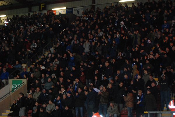 Rochdale supporters applaud their team at the final whistle as Dale go top of the league.