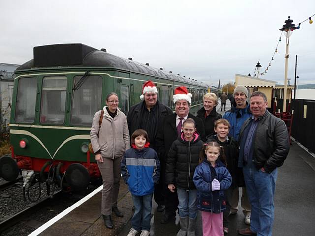 Councillor Keith Whitmore, Chairman of GMITA, and Heywood North Councillor Peter Rush, who is a member of the East Lancashire Railway Trust, with the special guests who joined them for a trip on the East Lancashire Railway's Santa Special on Saturday.