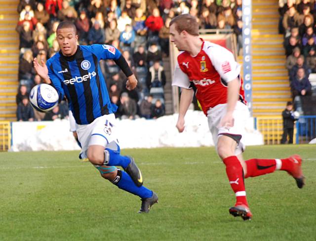 Joe Thompson tracks down possession.