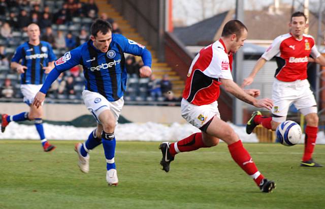 Chris Dagnall looks to get the wrong side of the Morecambe defence.