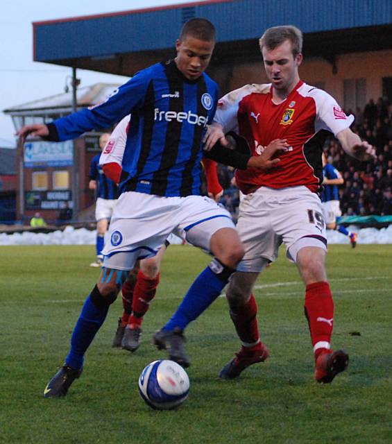 Thompson tussles with Laurence Wilson.