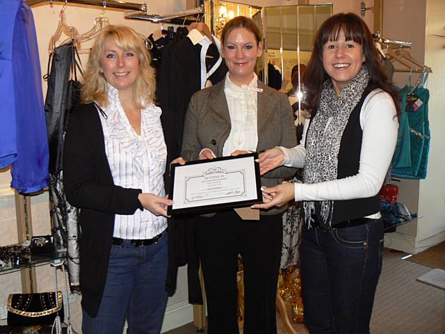 Joanne Matthews, owner of Best Dressed (left) and Claire Aspinall (right) receive their award from Katie Kinsella, Pennines Township Manager.
