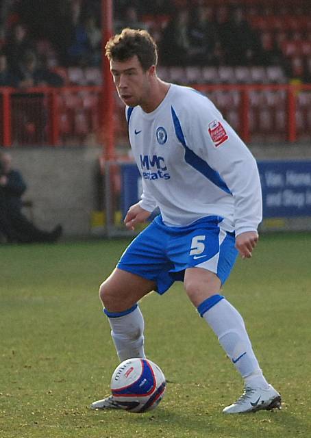 Clark Keltie picks up the ball on the edge of the Dagenham box.