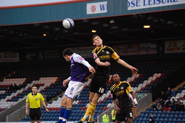 Brisley heads clear from Dagnall.