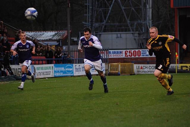 Dagnall and Carl Tremarco race for a long ball over the top.