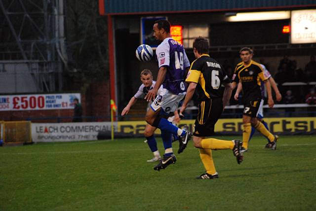 O'Grady brings the ball down with his back to Paul Morgan.