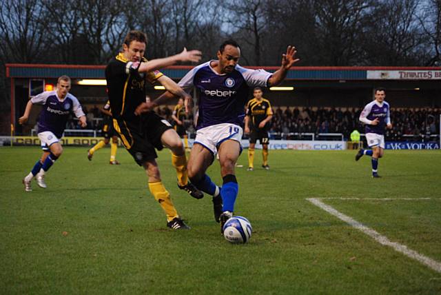 O'Grady outmuscles Morgan to set up Rochdale's opening goal.