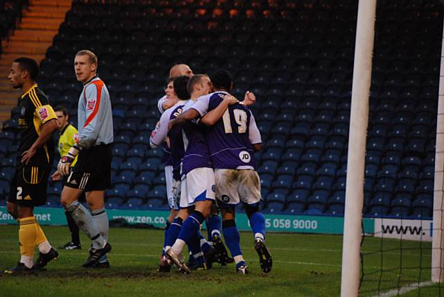 The home side continue their celebrations.