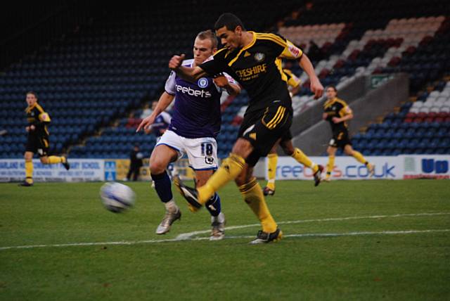 Daniel clears under pressure from Higginbotham.