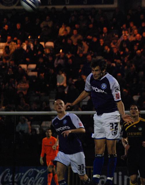 Atkinson heads the ball up the line.