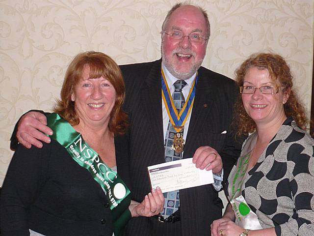 Rotary club President John Kay (centre) presents a £1000 cheque to NSPCC Littleborough District committee members Carol Kennedy and Ged O'Donnell.