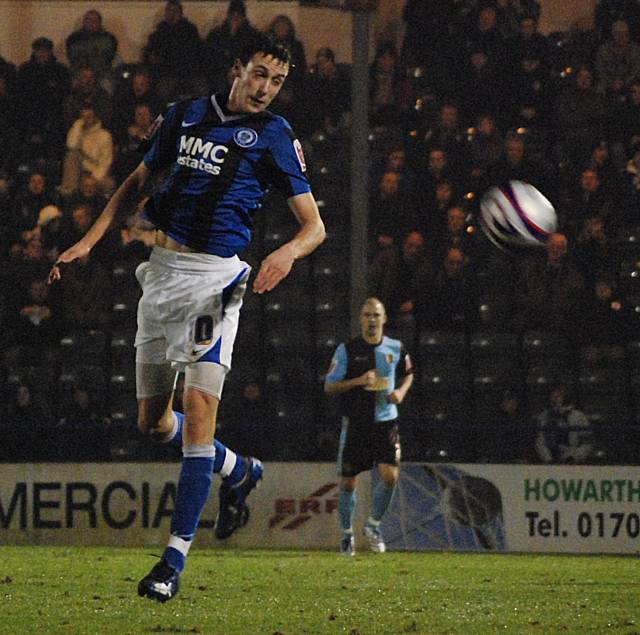 Will Buckley wins a header.