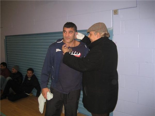 Rashid of Young Muslims receives his MOM Medal.