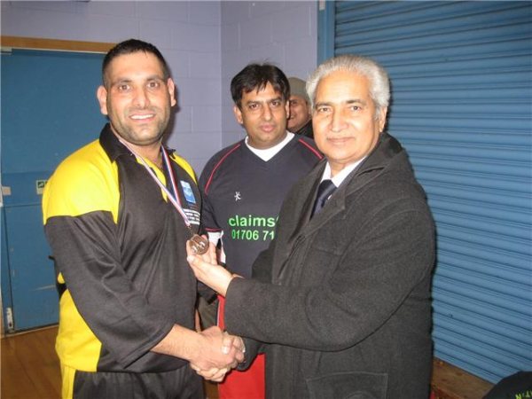 Rashid of Max XI receives his MOM medal.