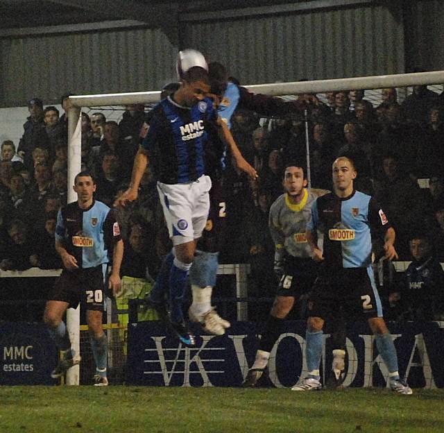 Joe Thompson goes up for a header from a Dale corner.