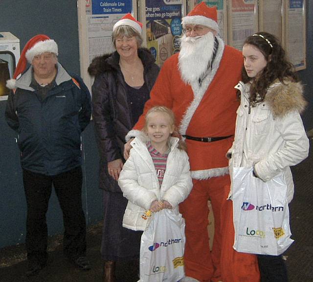 Father CHristmas, 2 elves and 2 customers