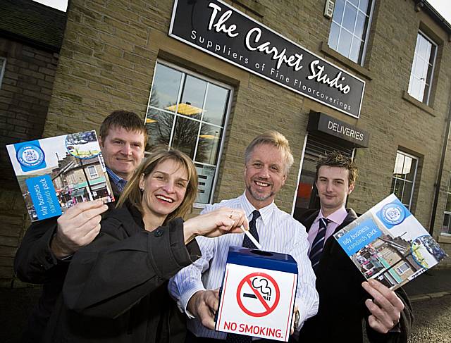 Tommy Downes from Rochdale Borough Council, Councillor Wera Hobhouse, Dave Wolstenholme from the Carpet Studio and Christian Crossley from Groundwork Oldham and Rochdale show their support for the Tidy Business Standards Charter.