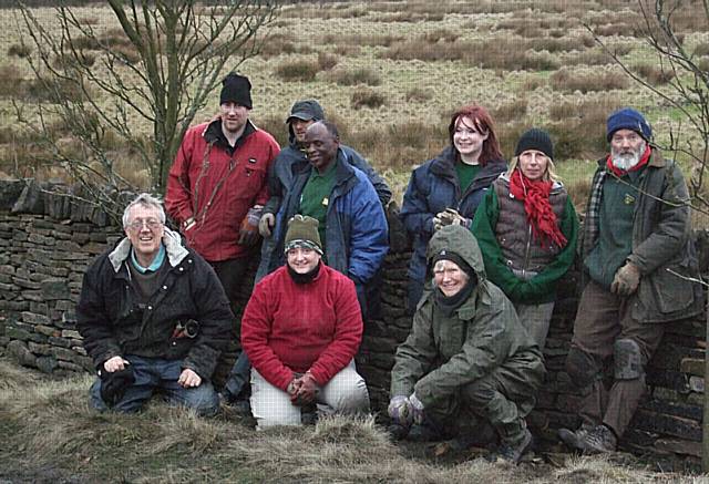 The Green Volunteers with their finished dry stone wall.