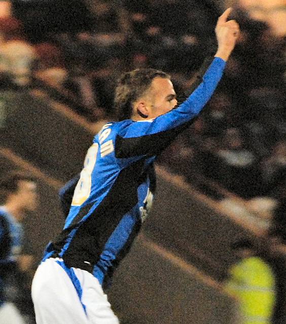 Kallum Higginbotham celebrates his late goal.