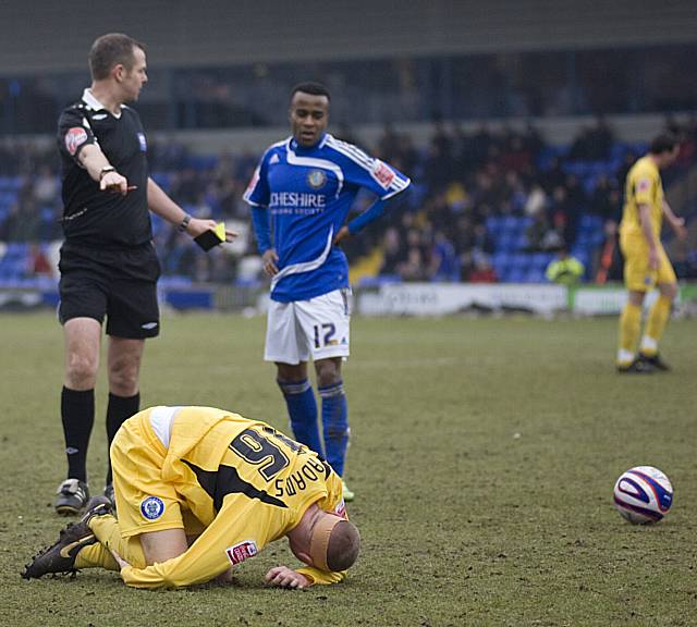 Reid sees yellow for a late tackle on Adams.