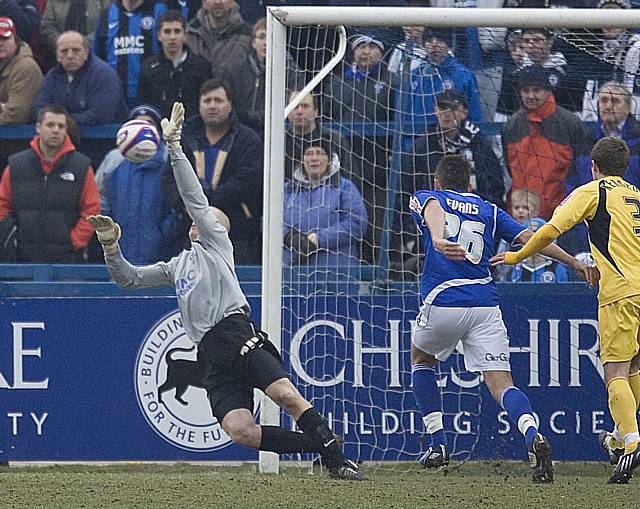 Fielding makes a fine save from Brown's deflected shot.