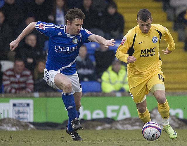 Adam Le Fondre tries to get beyond Paul Morgan.